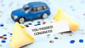 You passed driving test message beside a model car