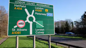 Road sign showing a large multi-exit roundabout