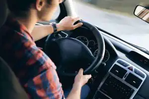 Driving instructor guiding a learner during their first lesson