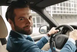 Driver checking mirrors before moving off