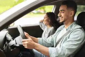 Driving instructor giving an overseas learner a lesson